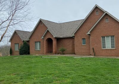 seamless gutters with leaf guards brick home